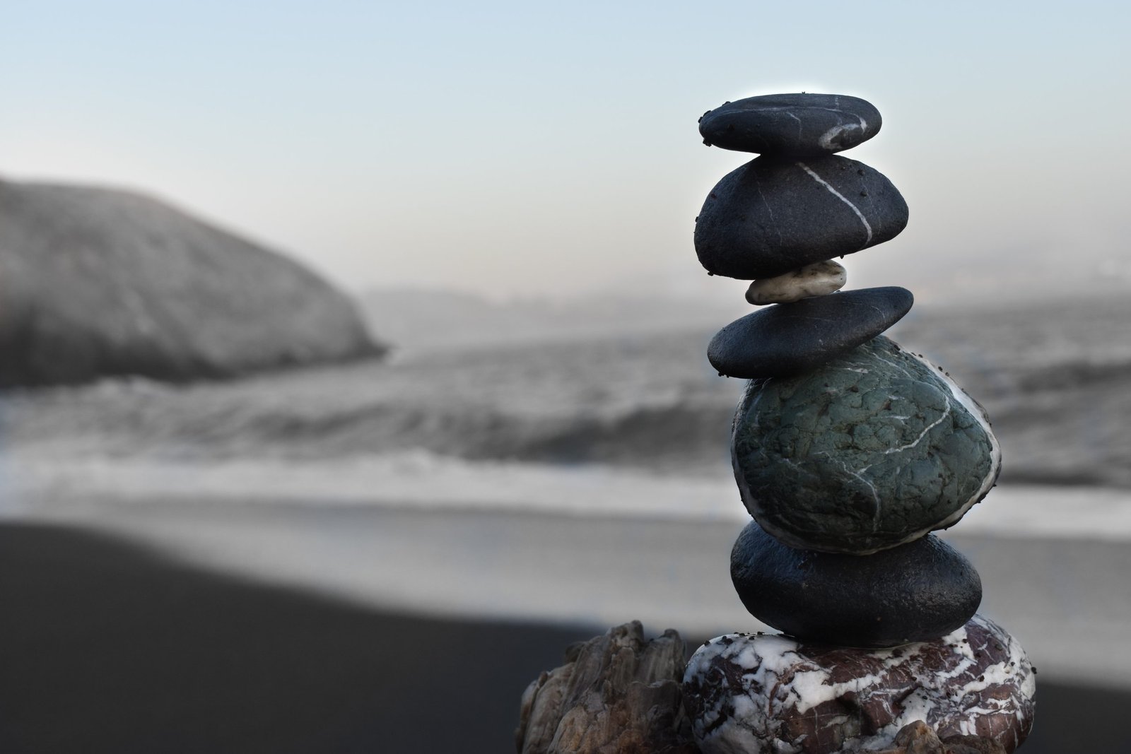 rocks stacked on sea shore